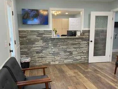 Front desk team at Bristol Dental Clinic welcoming a new patient